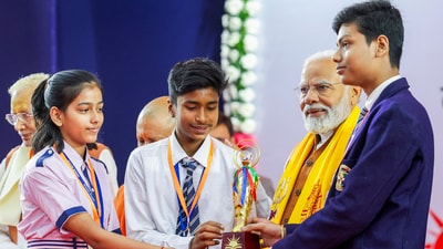 Prime Minister Narendra Modi distributed prizes to winners of Sansad Pratiyogita in Uttar Pradesh's Varanasi on Friday. Uttar Pradesh Chief Minister Yogi Adityanath was also present. The event was also attended by students and parents in large numbers. (PTI) Prime Minister Narendra Modi distributed prizes to winners of Sansad Pratiyogita in Uttar Pradesh's Varanasi on Friday. Uttar Pradesh Chief Minister Yogi Adityanath was also present. The event was also attended by students and parents in large numbers. (PTI)