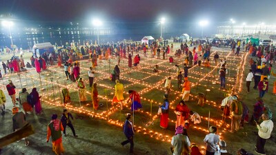 Hindu Devotees light earthern lamps on the eve of Maghi Purnima in Prayagraj. (PTI) Hindu Devotees light earthern lamps on the eve of Maghi Purnima in Prayagraj. (PTI)