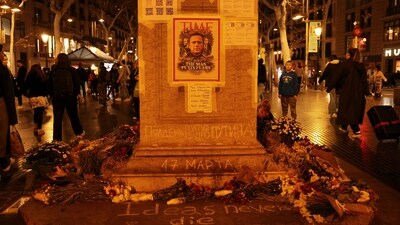Tributes are placed at the memorial site for Russian opposition leader Alexei Navalny at Las Ramblas, in Barcelona, Spain. (REUTERS)