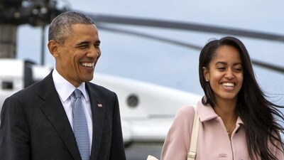 President Barack Obama jokes with his daughter Malia Obama as they walk to board Air Force One. Like her parents, Malia will be joining Harvard University in 2017, after taking a year off before that. (AP file photo)