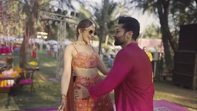 At one of their pre-wedding functions, presumingly the mehendi function, Rakul Preet Singh and Jackky Bhagnani were captured dancing together in an outdoor setting. She wore an orange ethnic outfit, while he was in a pink kurta. 