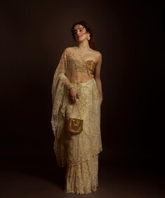 Sanya Malhotra in a white and golden saree and a golden bandeau blouse (Photo: Instagram)