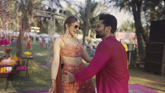At one of their pre-wedding functions, presumingly the mehendi function, Rakul Preet Singh and Jackky Bhagnani were captured dancing together in an outdoor setting. She wore an orange ethnic outfit, while he was in a pink kurta.