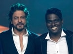 Shah Rukh Khan and Atlee pose for photographs during a press conference after success of their movie Jawan in Mumbai.