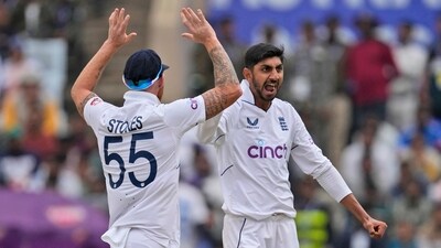 England's Shoaib Bashir, right, celebrates the wicket of India's Rajat Patidar during 4th Test (AP)
