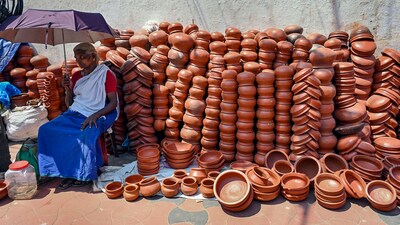 A clay pot vendor waits for customers ahead of the Attukal Pongala in Thiruvananthapuram. (PTI) A clay pot vendor waits for customers ahead of the Attukal Pongala in Thiruvananthapuram. (PTI)