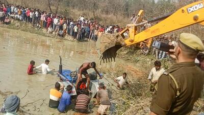 Rescue operation underway at the pond where at least 23 people, including eight children, died when their tractor-trolley overturned and fell in Kasganj of Uttar Pradesh on Saturday. (PTI) Rescue operation underway at the pond where at least 23 people, including eight children, died when their tractor-trolley overturned and fell in Kasganj of Uttar Pradesh on Saturday. (PTI)