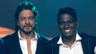 Shah Rukh Khan and Atlee pose for photographs during a press conference after success of their movie Jawan in Mumbai. (AP) Shah Rukh Khan and Atlee pose for photographs during a press conference after success of their movie Jawan in Mumbai. (AP)