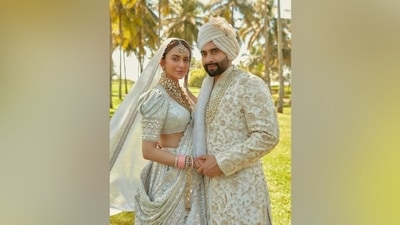 Celebrity stylist Ami Patel shared Rakul Preet and Jackky Bhagnani's pictures from their latest bridal photoshoot on Instagram. The couple wore bridal ensembles designed by Tarun Tahiliani for the occasion. They chose an ivory theme for their attires. While Rakul wore a mirror-work lehenga, Jackky donned a heavily-embroidered sherwani. (Instagram/@stylebyami) Celebrity stylist Ami Patel shared Rakul Preet and Jackky Bhagnani's pictures from their latest bridal photoshoot on Instagram. The couple wore bridal ensembles designed by Tarun Tahiliani for the occasion. They chose an ivory theme for their attires. While Rakul wore a mirror-work lehenga, Jackky donned a heavily-embroidered sherwani. (Instagram/@stylebyami)