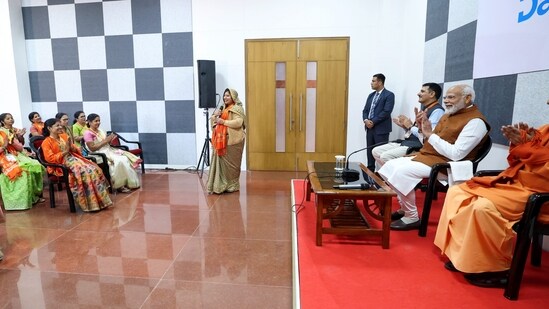 Prime Minister Narendra Modi interacted with women beneficiaries during Amul's Banas Dairy Plant inauguration event, in Varanasi on Friday. Uttar Pradesh Chief Minister Yogi Adityanath was also present on the occasion.&nbsp;(PTI)