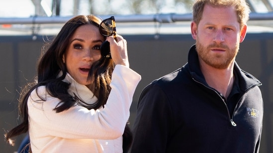 FILE - Prince Harry and Meghan Markle, Duke and Duchess of Sussex visit the track and field event at the Invictus Games in The Hague, Netherlands, Sunday, April 17, 2022. The production company founded by Prince Harry and his wife, Meghan, are splitting ways with Spotify, Friday, June 16, 2023, less than a year after the debut of their podcast “Archetypes."(AP Photo/Peter Dejong, File) (AP)
