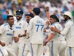 India celebrate a wicket against England. India celebrate a wicket against England.