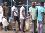 Bengaluru water woes: People stand in long queues with water cans. Watch Bengaluru water woes: People stand in long queues with water cans. Watch