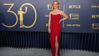Reese Witherspoon opted for a strapless Elie Saab couture design, showcasing a wrap bodice and a thigh-high slit. She complemented her look with matching satin Gianvito Rossi heels and yellow diamond jewelry by Bucherer. (Jordan Strauss/Invision/AP) Reese Witherspoon opted for a strapless Elie Saab couture design, showcasing a wrap bodice and a thigh-high slit. She complemented her look with matching satin Gianvito Rossi heels and yellow diamond jewelry by Bucherer. (Jordan Strauss/Invision/AP)