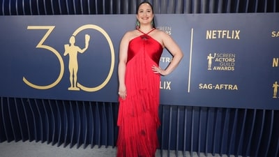 Lily Gladstone looked exquisite in a custom Armani Privé gown, which featured a bedazzled fan detail at the neckline and layers of red ombre fringe. (AP) Lily Gladstone looked exquisite in a custom Armani Privé gown, which featured a bedazzled fan detail at the neckline and layers of red ombre fringe. (AP)