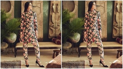 Sonam's elegant outfit featured a black bandh gala kurta with full sleeves, a straight cut, a button fastening, a centre slit and an enchanting floral print in shades of pastel pink and green all over. She paired it with a matching fitted trouser. (Instagram/@sonamkapoor) Sonam's elegant outfit featured a black bandh gala kurta with full sleeves, a straight cut, a button fastening, a centre slit and an enchanting floral print in shades of pastel pink and green all over. She paired it with a matching fitted trouser. (Instagram/@sonamkapoor)