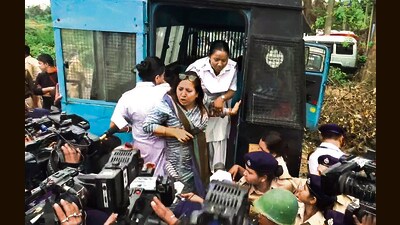 A member of the fact-finding committee being taken into custody on Sunday. (ANI)