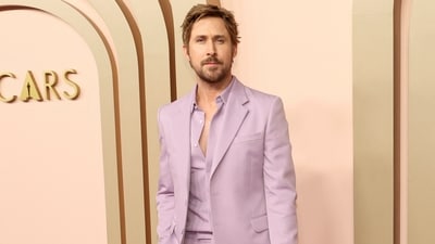 Ryan Gosling made a dashing appearance at the show in a custom pale blue suit by Gucci, complemented by a gold watch.&nbsp; (REUTERS)