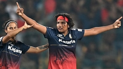 Royal Challengers Bangalore's Sobhana Asha (R) celebrates with teammates the dismissal of UP Warriorz's Shwetha Sehrawat during the Women's Premier League (WPL) (AFP) Royal Challengers Bangalore's Sobhana Asha (R) celebrates with teammates the dismissal of UP Warriorz's Shwetha Sehrawat during the Women's Premier League (WPL) (AFP)
