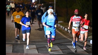 Participants during the 13th Punjab Half Marathon, organised to raise awareness against drugs, in Chandigarh. (Keshav Singh/HT)