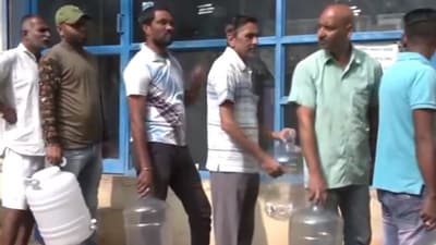 Bengaluru water woes: People stand in long queues with water cans. Watch Bengaluru water woes: People stand in long queues with water cans. Watch