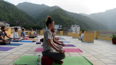 6. Self awareness and discovery: Beyond the physical benefits, couples yoga retreats offer an opportunity for introspection and self-discovery. Partners gain insights into their own emotions and reactions, fostering a deeper understanding of themselves and each other. This self-awareness contributes to a more empathetic and supportive relationship dynamic. (Photo by Sajjad Hussain / AFP) 6. Self awareness and discovery: Beyond the physical benefits, couples yoga retreats offer an opportunity for introspection and self-discovery. Partners gain insights into their own emotions and reactions, fostering a deeper understanding of themselves and each other. This self-awareness contributes to a more empathetic and supportive relationship dynamic. (Photo by Sajjad Hussain / AFP)