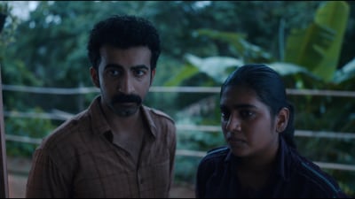 Roshan Mathew and Nimisha Sajayan in a still from Poacher. Roshan Mathew and Nimisha Sajayan in a still from Poacher.