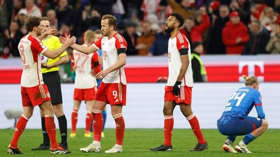 Bayern Munich's English forward #09 Harry Kane (C) and his teammates celebrate after the German first division Bundesliga football match between FC Bayern Munich and RB Leipzig (AFP)