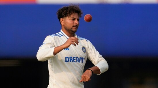 India's Kuldeep Yadav prepares to bowl on the third day of the fourth Test against England (AP)