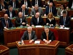 Hungarian Prime Minister Viktor Orban right, and Zsolt Semjen, the Hungarian Deputy Prime Minister, vote along with lawmakers on approving Sweden's accession into NATO Hungarian Prime Minister Viktor Orban right, and Zsolt Semjen, the Hungarian Deputy Prime Minister, vote along with lawmakers on approving Sweden's accession into NATO