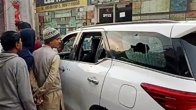 People gather at the site after Haryana INLD chief Nafe Singh Rathee was shot dead by unidentified assailants, at Jhajjar on Sunday. (ANI)