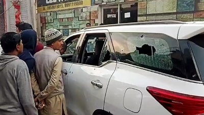 People gather at the site after Haryana INLD chief Nafe Singh Rathee was shot dead by unidentified assailants, at Jhajjar on Sunday. (ANI) People gather at the site after Haryana INLD chief Nafe Singh Rathee was shot dead by unidentified assailants, at Jhajjar on Sunday. (ANI)