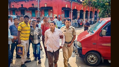 Arrested TMC leader Ajit Maity being produced before a local court on Monday. (PTI)