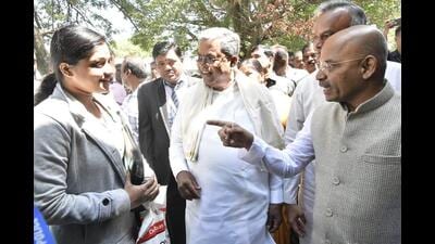 Chief minister Siddaramaiah and skill development minister Sharan Prakash Patil interact with job aspirants on Monday. (HT) Chief minister Siddaramaiah and skill development minister Sharan Prakash Patil interact with job aspirants on Monday. (HT)