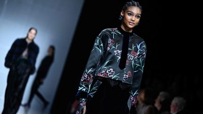 A model walks the runway during the Giorgio Armani collection show at the Milan Fashion Week Womenswear Autumn/Winter 2024-2025. (Photo by GABRIEL BOUYS / AFP) A model walks the runway during the Giorgio Armani collection show at the Milan Fashion Week Womenswear Autumn/Winter 2024-2025. (Photo by GABRIEL BOUYS / AFP)