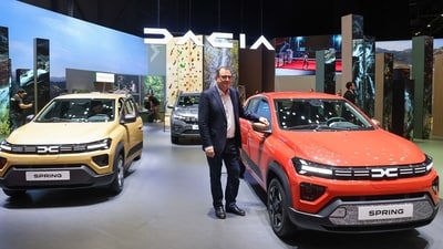 Denis Le Vot, CEO of the Dacia brand for Renault SA, presents Dacia Spring Electric Vehicles at the Geneva International Motor Show on Monday. (Bloomberg)