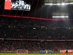 Players observe a minute of silence for former player Andreas Brehme during the German Bundesliga soccer match between FC Bayern Munich and RB Leipzig at the Allianz Arena in Munich, Germany, Feb. 24, 2024. (AP Photo/Matthias Schrader)