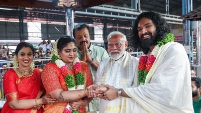 Prime Minister Narendra Modi blesses the newly-wedded daughter and son-in-law of actor-politician Suresh Gopi while visiting Guruvayur Temple in Thrissur district on Wednesday (ANI) (HT_PRINT) Prime Minister Narendra Modi blesses the newly-wedded daughter and son-in-law of actor-politician Suresh Gopi while visiting Guruvayur Temple in Thrissur district on Wednesday (ANI) (HT_PRINT)