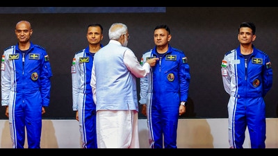 Prime Minister Narendra Modi hands-over wings to astronauts-designate Shubanshu Shukla, Prashanth Balakrishnan Nair, Angad Prathap and Ajit Krishnan who have been selected to be the astronauts on India’s first crewed mission to space 'Gaganyaan Mission', at the Vikram Sarabhai Space Centre (VSSC), in Thiruvananthapuram. (PTI) Prime Minister Narendra Modi hands-over wings to astronauts-designate Shubanshu Shukla, Prashanth Balakrishnan Nair, Angad Prathap and Ajit Krishnan who have been selected to be the astronauts on India’s first crewed mission to space 'Gaganyaan Mission', at the Vikram Sarabhai Space Centre (VSSC), in Thiruvananthapuram. (PTI)