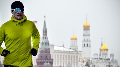 A man runs in front of the Kremlin in downtown Moscow on February 24, 2024. Russia's ex-president Dmitry Medvedev, a leading hawk on the Ukraine offensive, said Saturday Moscow will seek "revenge" for massive Western sanctions. A day earlier, the US unveiled fresh sanctions on the eve of the second anniversary of Moscow's Ukraine campaign and after the death in prison of opposition leader Alexei Navalny. (Photo by Alexander NEMENOV / AFP) (AFP) A man runs in front of the Kremlin in downtown Moscow on February 24, 2024. Russia's ex-president Dmitry Medvedev, a leading hawk on the Ukraine offensive, said Saturday Moscow will seek "revenge" for massive Western sanctions. A day earlier, the US unveiled fresh sanctions on the eve of the second anniversary of Moscow's Ukraine campaign and after the death in prison of opposition leader Alexei Navalny. (Photo by Alexander NEMENOV / AFP) (AFP)