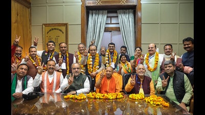 Uttar Pradesh Chief Minister Yogi Adityanath, Deputy Chief Minister Keshav Prasad Maurya and other leaders with the BJP candidates who have been elected as Rajya Sabha MPs in the the recently-held polls, in Lucknow (PTI) Uttar Pradesh Chief Minister Yogi Adityanath, Deputy Chief Minister Keshav Prasad Maurya and other leaders with the BJP candidates who have been elected as Rajya Sabha MPs in the the recently-held polls, in Lucknow (PTI)