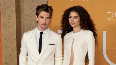 Zendaya looked stunning in a white floor-length, long-sleeved dress featuring daring cut-outs down the front. The dress' hem was adorned with golden, sculptural details for a striking, futuristic effect. Austin matched Zendaya perfectly in the same, off-white coloured suit. (Getty Images via AFP) Zendaya looked stunning in a white floor-length, long-sleeved dress featuring daring cut-outs down the front. The dress' hem was adorned with golden, sculptural details for a striking, futuristic effect. Austin matched Zendaya perfectly in the same, off-white coloured suit. (Getty Images via AFP)