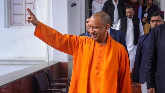 Uttar Pradesh Chief Minister Yogi Adityanath leaves after casting his vote for the Rajya Sabha elections in Lucknow.(PTI)