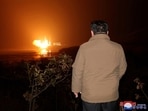 North Korean leader Kim Jong Un looks on as a rocket carrying a spy satellite Malligyong-1 is launched in a location given as North Gyeongsang Province, North Korea in this handout picture obtained by Reuters on November 21, 2023. 