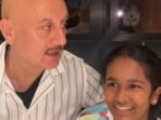 (L) Anupam Kher with Satish Kaushik's daughter Vanshika; late actor in a still from Kaagaz 2. (L) Anupam Kher with Satish Kaushik's daughter Vanshika; late actor in a still from Kaagaz 2.