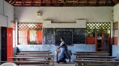 A staff member walks inside an empty classroom of a school after Kerala state government ordered the closure of schools across the state, amid coronavirus fears, in Kochi, India March 12, 2020. REUTERS/Sivaram V (REUTERS)