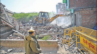 Forest officials raze an illegal house encroaching on the Ridge on Wednesday. (Sanchit Khanna/HT Photo) Forest officials raze an illegal house encroaching on the Ridge on Wednesday. (Sanchit Khanna/HT Photo)