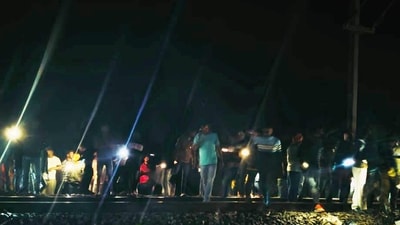 People stand near a railway track where at least two persons were run over and killed by a train near Kaljharia area, in Jamtara district on Feb. 28. (PTI) People stand near a railway track where at least two persons were run over and killed by a train near Kaljharia area, in Jamtara district on Feb. 28. (PTI)