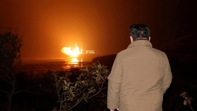 North Korean leader Kim Jong Un looks on as a rocket carrying a spy satellite Malligyong-1 is launched in a location given as North Gyeongsang Province, North Korea in this handout picture obtained by Reuters on November 21, 2023. (KCNA/Reuters)