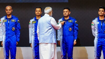 Prime Minister Narendra Modi hands-over wings to astronauts-designate Shubanshu Shukla, Prashanth Balakrishnan Nair, Angad Prathap and Ajit Krishnan who have been selected to be the astronauts on India’s first crewed mission to space 'Gaganyaan Mission', at the Vikram Sarabhai Space Centre (VSSC), in Thiruvananthapuram. (PTI) (HT_PRINT)